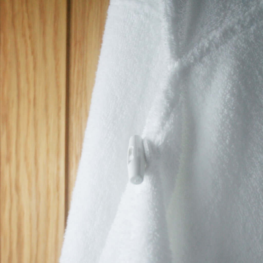 Toggle button close for modesty on our hooded towels