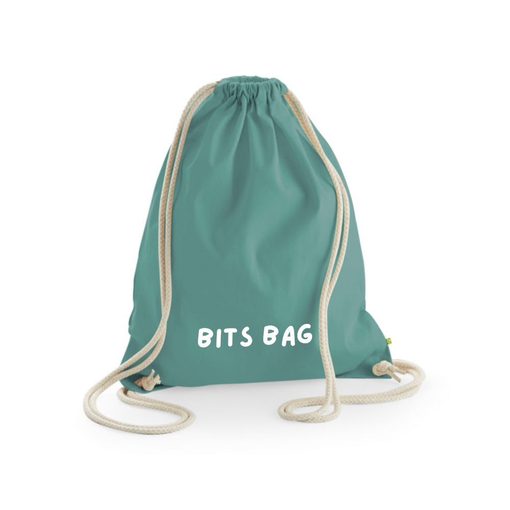 A sage green bag with cord drawstring handles, personalised for a child.