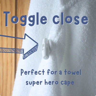White towel with text suggesting it's perfect for a 'super hero cape' and an arrow pointing to a button.