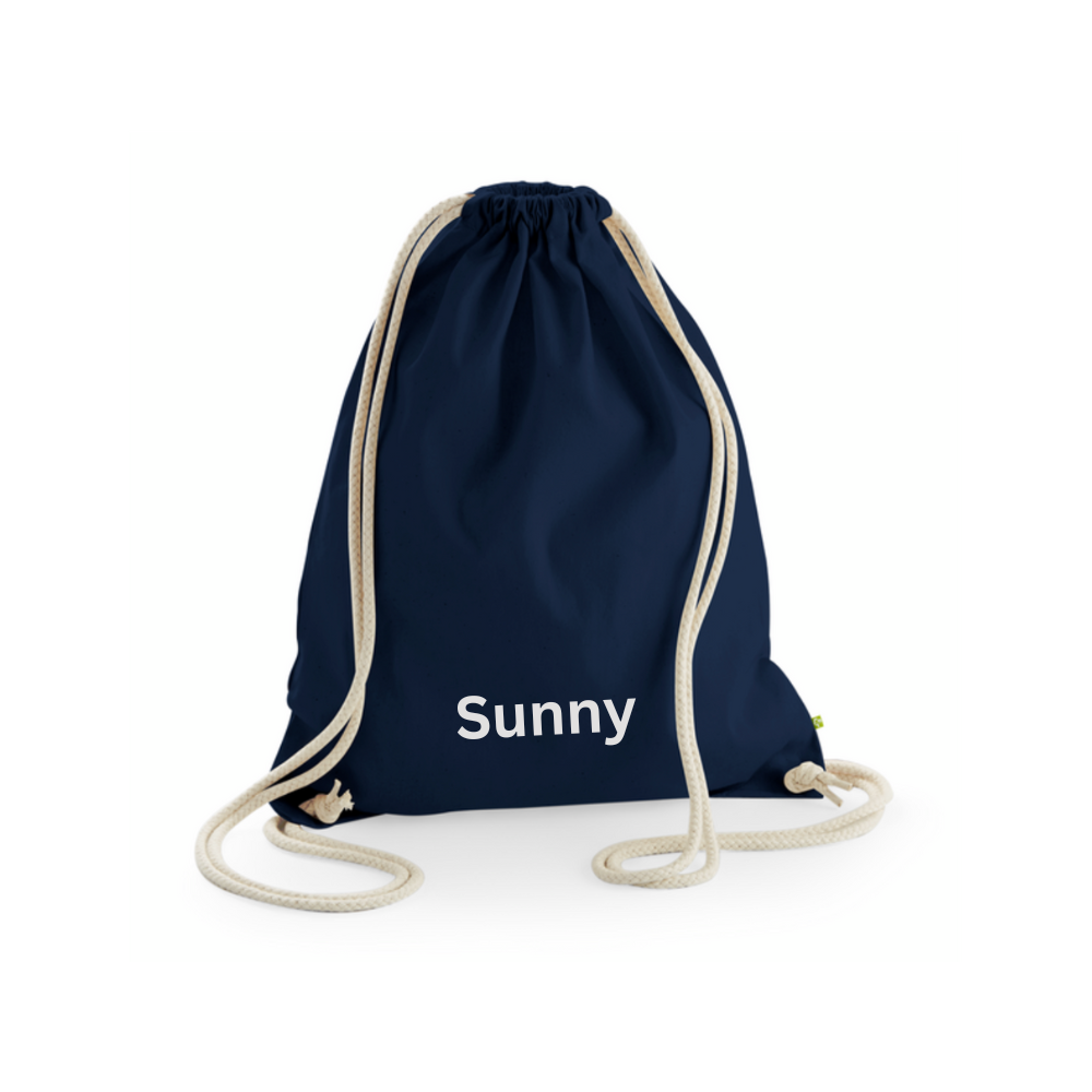 A navy blue bag with cord drawstring handles, personalised for a child.