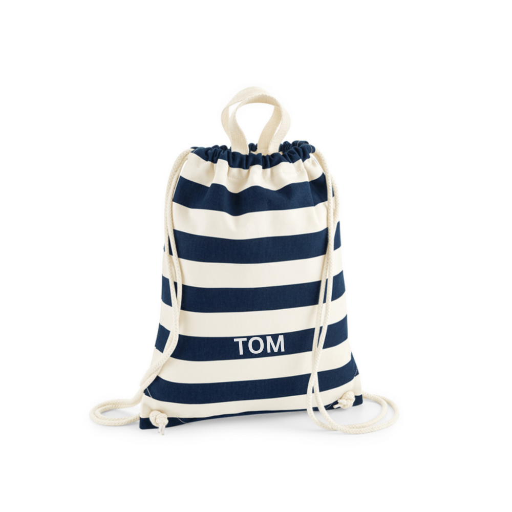 A navy blue and cream striped drawstring bag with top handles, that can be personalised with a child's name.