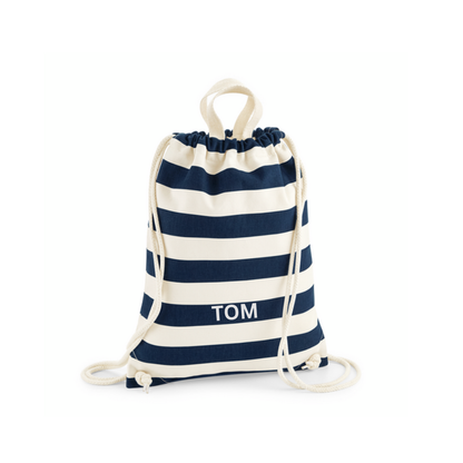 A navy blue and cream striped drawstring bag with top handles, that can be personalised with a child's name.
