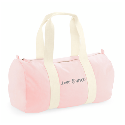 Personalised pink barrel bag for kids made of 100% cotton with woven cotton handles.